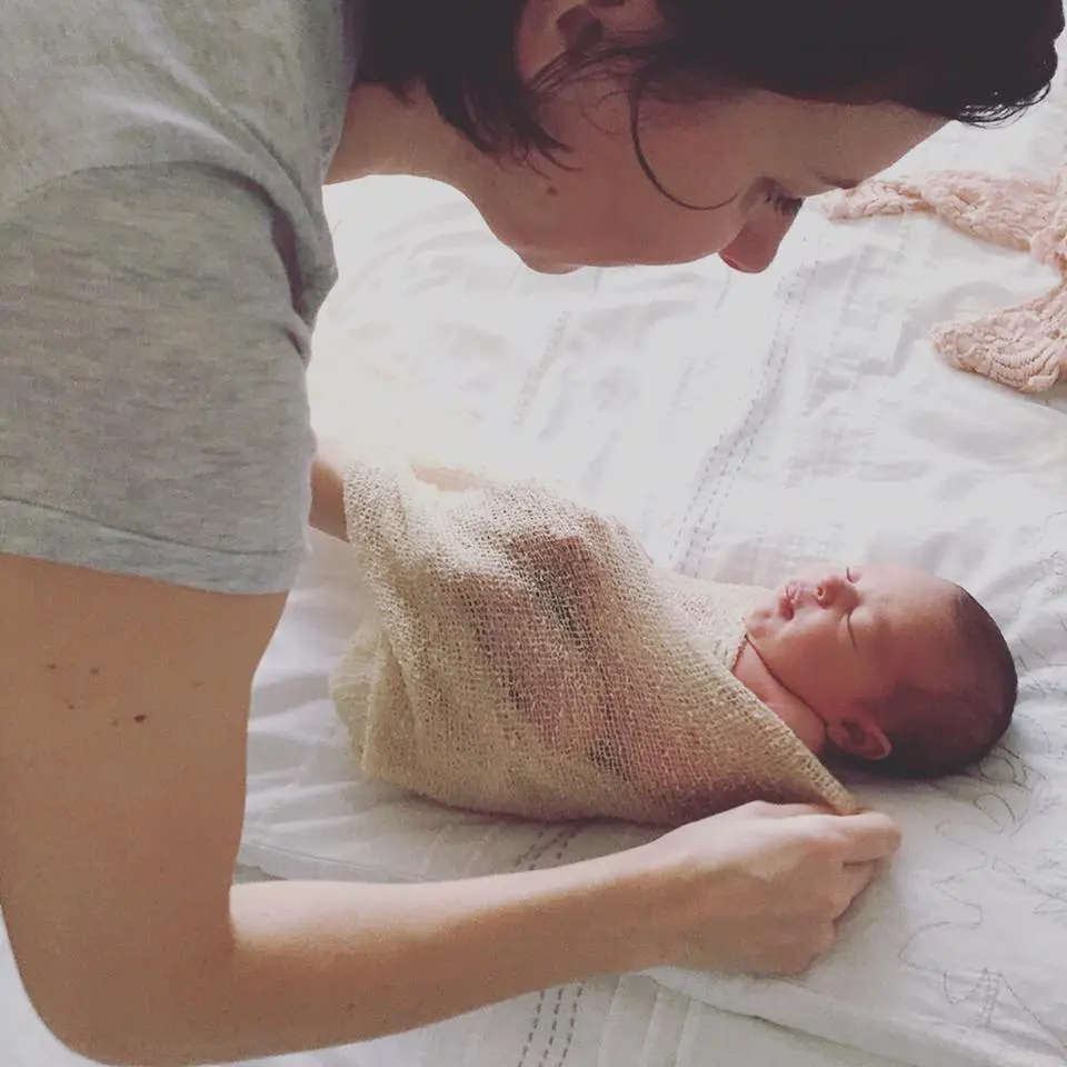 newborn photography fun facts: BTs showing Valentina wrapping baby