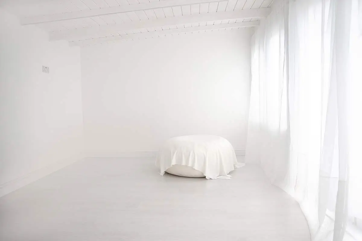 Bright and airy newborn photography studio in Twickenham, featuring white walls and natural light for a calm, welcoming experience.