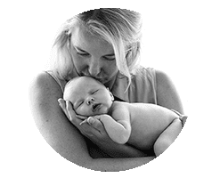 mum holding newborn baby and kissing her. Black and white image