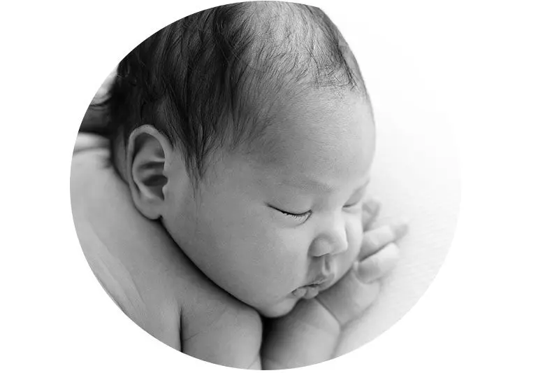 black and white portrait of newborn face close up. Photo taken during a newborn photoshoot in London