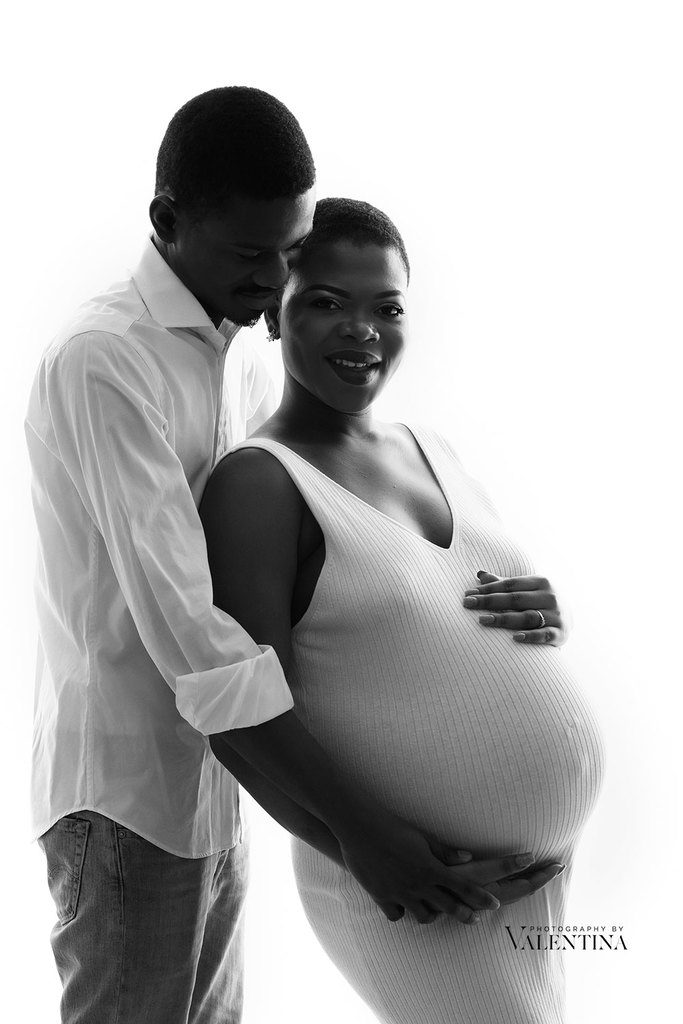 black and white image of pregnant couple