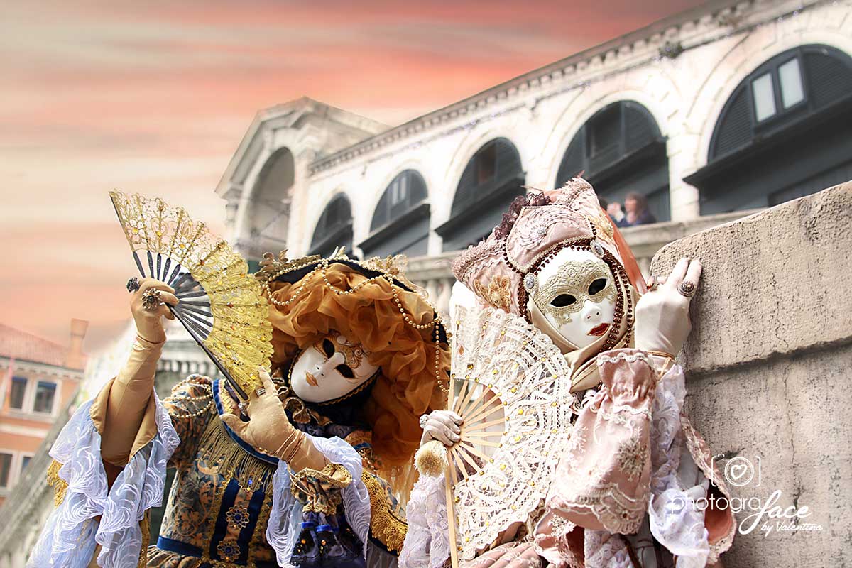 masks by rialto bridge during carnival in venice