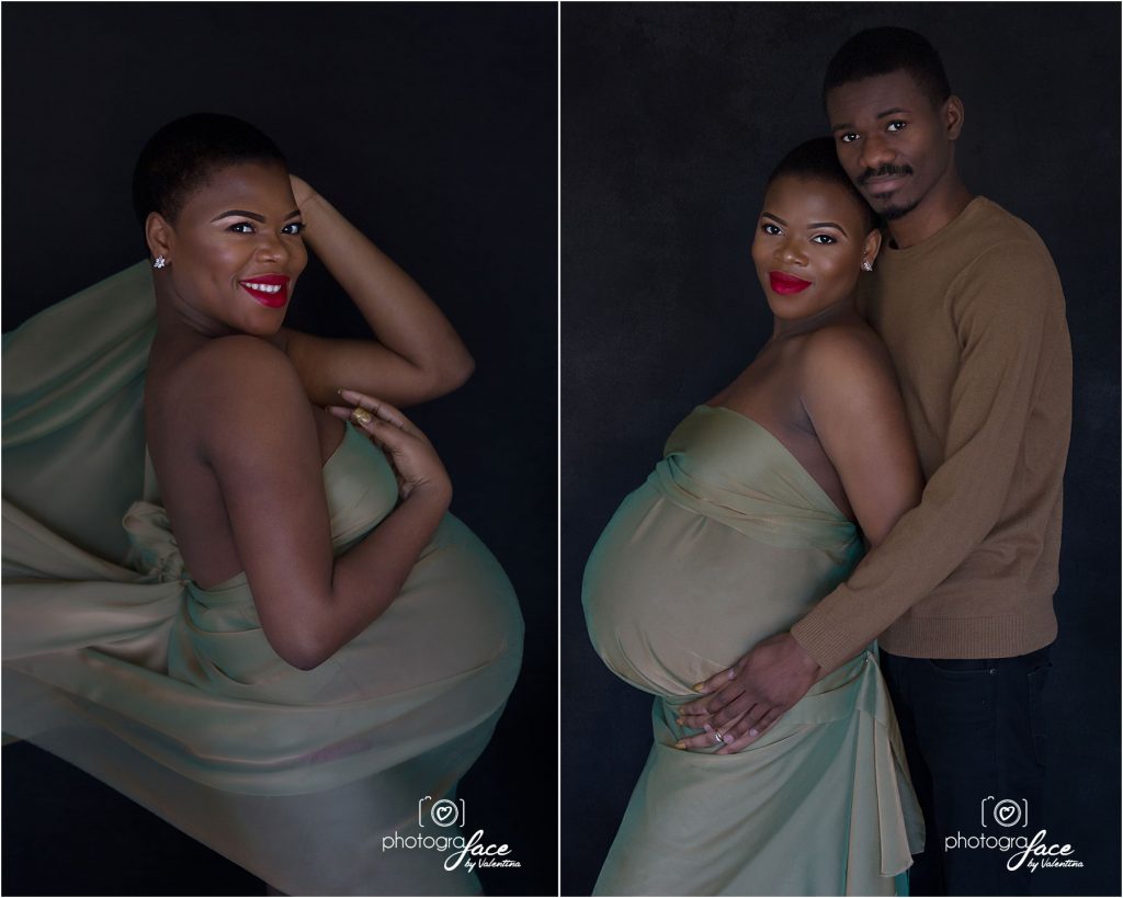 pregnant woman photographed on a black background wearing a piece of fabric