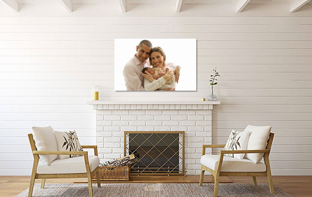 wall art with family newborn photos displayed over the fireplace