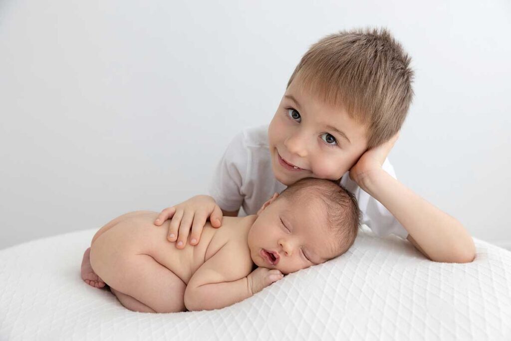 newborn with his sibling