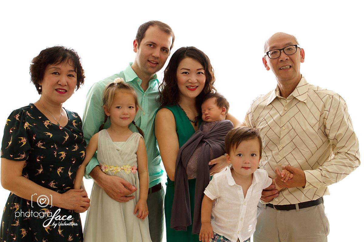 portrait of Asian family welcoming a newborn baby
