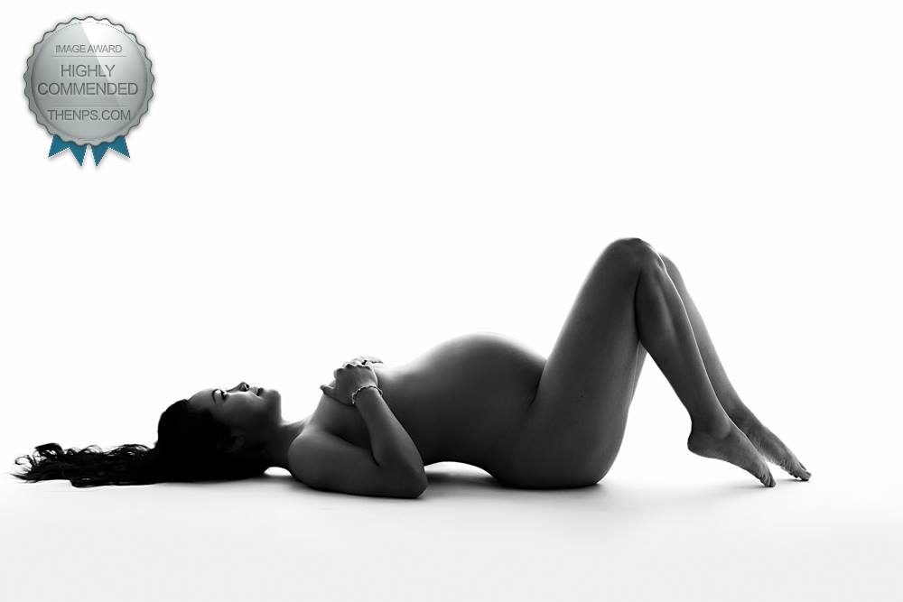 London award winning maternity photographer. Silhouette  of pregnant woman