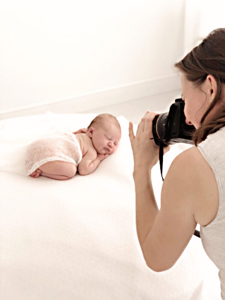valentina photographing a newborn baby in her studio