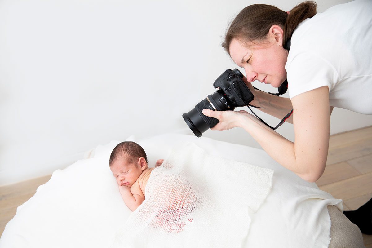 behnd the scene: london newborn photogrpaher valentina taking photo of a baby newborn