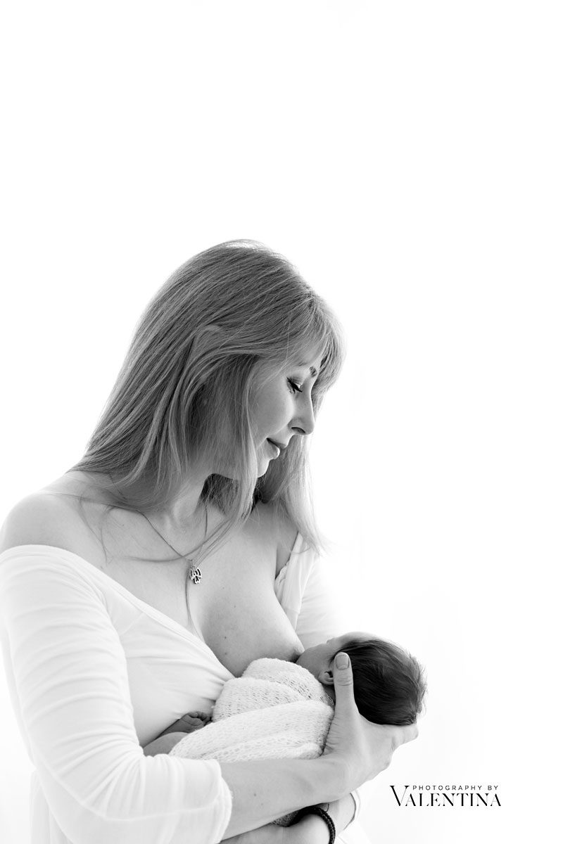black and white image mum breastfeeding newborn baby - from a newborn photography session