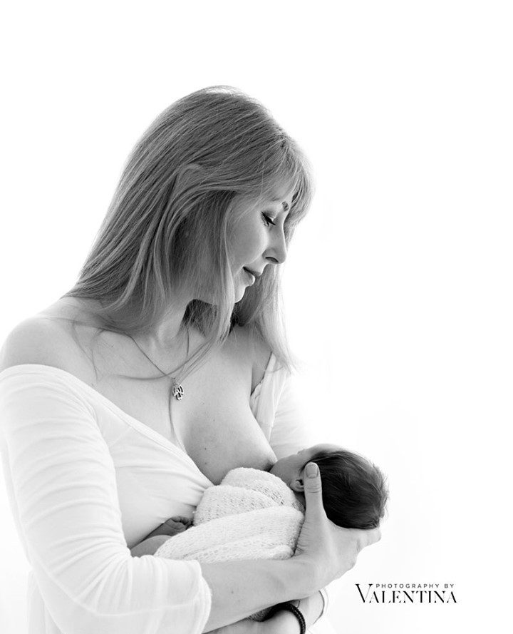 mum breastfeeding her baby - black and white image