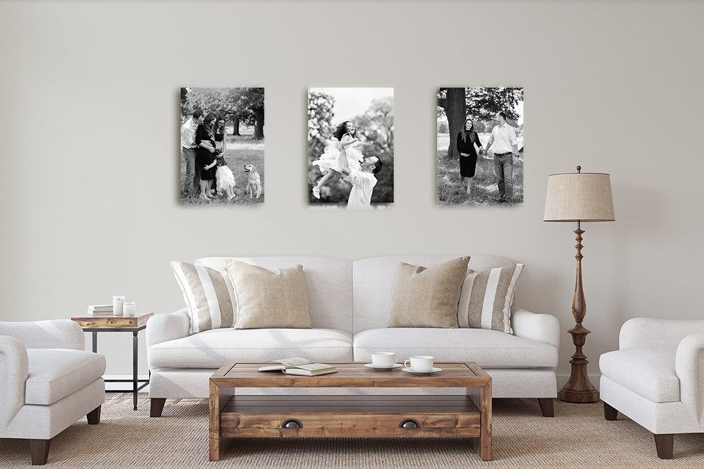 Living room wall dressed with 3 black and white portraits taken during an outdoor maternity shoot. Because maternity photos are worth it and deserve to be displayed.
