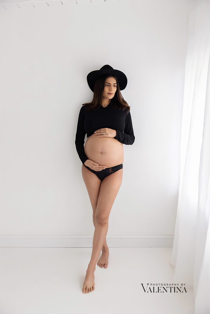 portrait of pregnant woman during a maternity photoshoot.