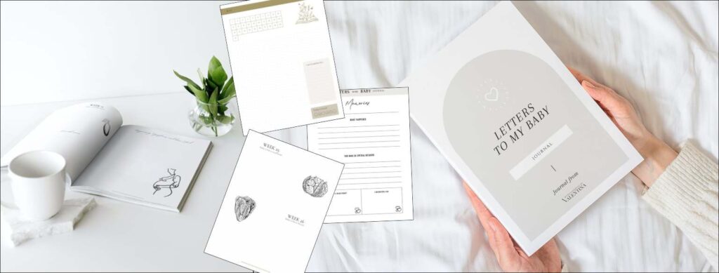 Flat lay of pregnancy and baby journal pages with a soft cup, flower vase, and hands holding the “Letters to My Baby” guide, a gentle writing tool for expectant mums.
