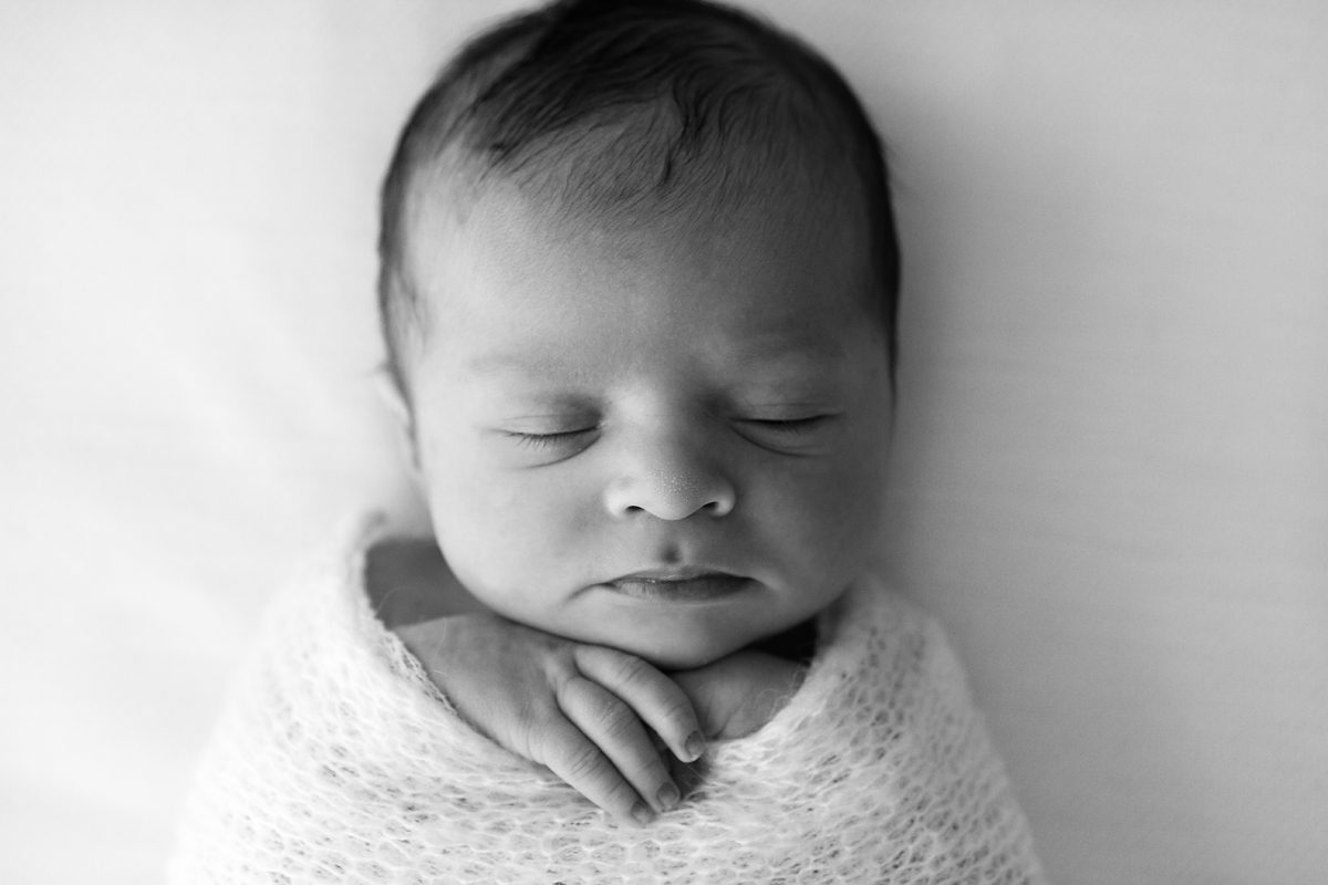 black and white portrait of a sleeping newborn